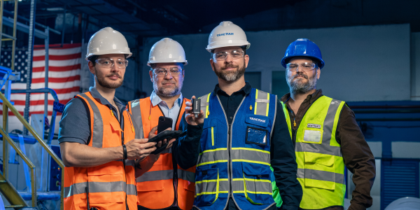 Tractian engineers walking the plant floor during an Asset Risk Assessment visit